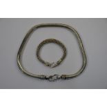 A heavy white metal snake link rope style necklace to/w a rope style bracelet