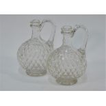 A pair of early 19th century heavy cut glass wine-flasks
