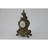 A rococco style gilt brass cased eight day table clock