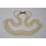 A three row graduated pearl necklace