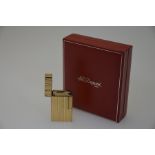S J Dupont - A cased gilt metal cigarette lighter
