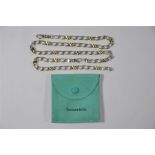Tiffany & Co - A white metal flat curb link necklace and matching bracelet,