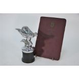 A Rolls-Royce chrome mascot, The Spirit of Ecstasy