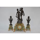 A late 19th/20th century green onyx spelter figural three piece clock garniture