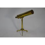 A 19th century brass 3 in reflecting astral telescope on folding tripod stand