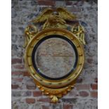 A 19th century giltwood framed circular mirror