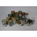Thirteen jars of antique and later glass and ceramic marbles