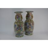 A pair of Chinese Canton famille rose vases, late Qing period, 58 cm high