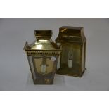 Two antique style brass wall lanterns with 3-sided glazed panels