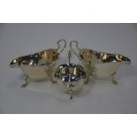 Three silver sauce boats