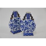A pair of Victorian blue and white Ridgway, Sparks and Ridgway pottery moonflasks