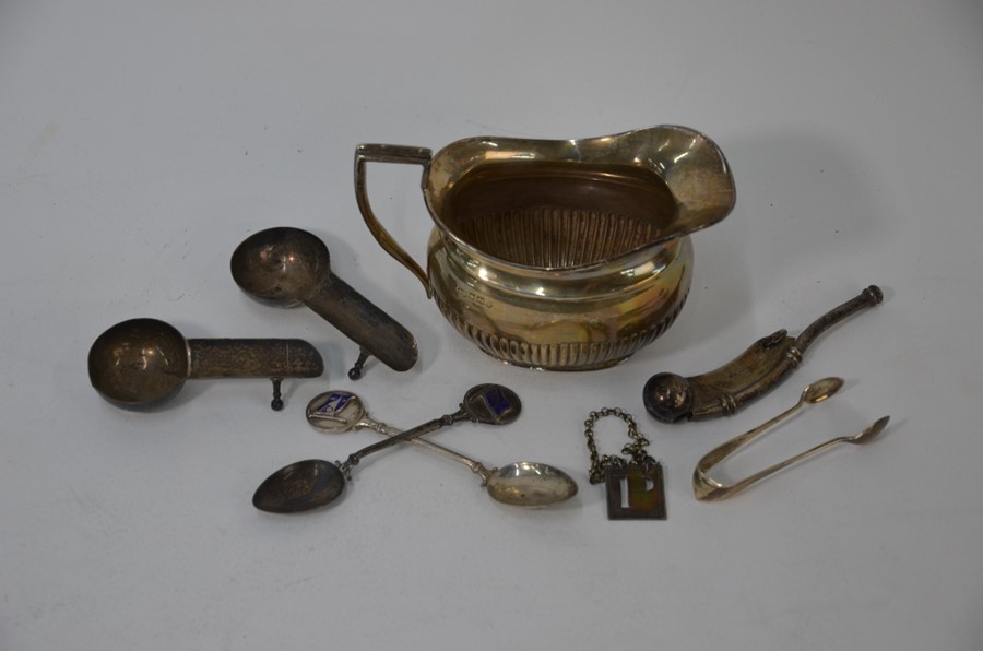 A Georgian silver bottle ticket and later silver and electroplated items