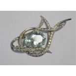 An aquamarine and diamond set brooch/pendant