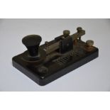 A black bakelite morse code key