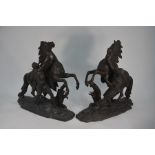 A large companion pair of 19th century cast spelter Marley horses, 56 cm h