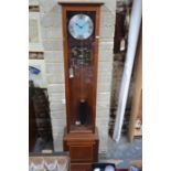 A contemporary teak cased electro-magnetic longcase clock