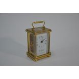 A lacquered brass carriage clock