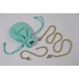 Tiffany & Co - A white and yellow metal rope style chain necklace and bracelet set