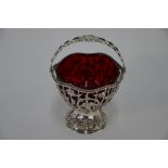 A Victorian pierced silver bonbon basket with swing handle