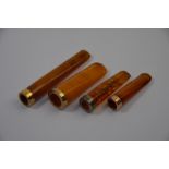 Four amber cheroot holders