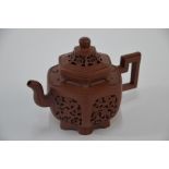 A 20th century Chinese Yixing teapot and cover of hexagonal form, Kangxi style