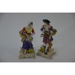 A pair of Meissen style porcelain figures of game sellers