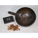A turned wood grain scoop with plain handle and a classical cameo