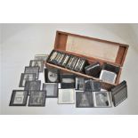 A wooden box of approx 85 Victorian magic lantern slides