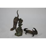 A brown patinated bronze diving otter