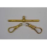 A 15 ct yellow gold bar and swivel