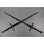 Two replica Scottish Claymore swords