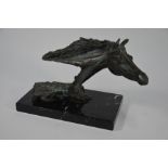 A cold-cast bronze horse's head sculpture