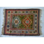 An antique Caucasian Kazak rug, 124cm x 90 cm