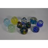 Eight various abstract design bubble paperweights