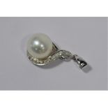 A cultured pearl and white stone scroll pendant