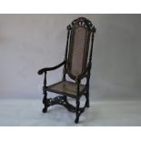 An antique Carolean style high-back open armchair
