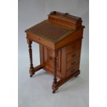 A late 19th century oak Davenport desk