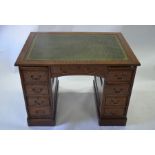 An oak twin pedestal desk,circa 1920's