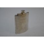 An engine-turned silver hip-pocket flask