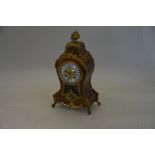 A brass and gilt metal mounted boulle style mantel clock
