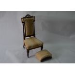 A late Victorian rosewood framed nursing chair upholstered in worn faux plush leopard spot fabric