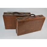 Two vintage leather suitcases