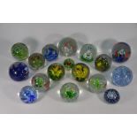 A selection of thirteen glass 'Aquarium' paperweights