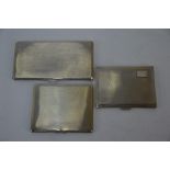 Three heavy quality silver Art Deco style engine-turned cigarette cases