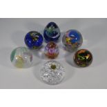 Six various glass paperweights