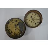 Two brass bulkhead clocks