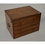 An antique satinwood collectors chest, the hinged top covering a shallow well over four long