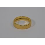 An 18ct yellow gold flat wedding band