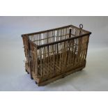 A vintage steel framed wicker and stick laundry trolley