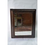 A 17th/18th century 18th oyster veneer cushion framed mirror